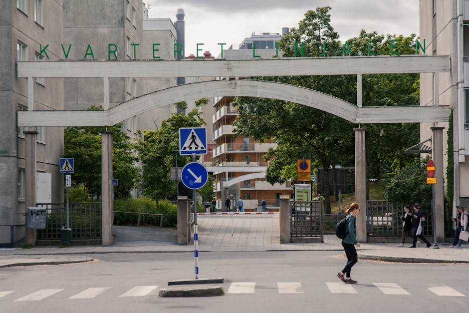 Pedestrian crossing a street at Kvarteret Linjalen, Stockholm, Sweden.