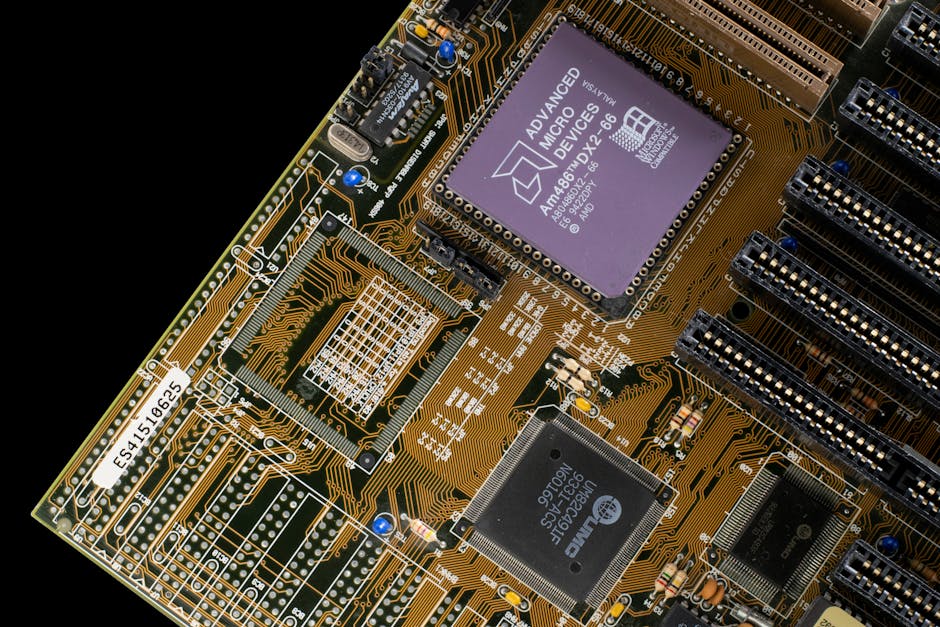 Detailed view of a vintage motherboard with microchips and circuits, showcasing retro technology.